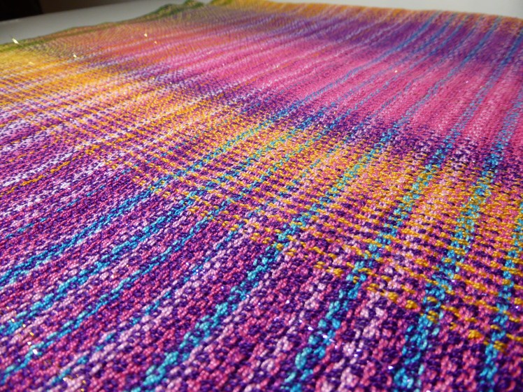 Colours of India baby wrap Fuchsia, Purple Passion and Dark Gold merc cotton weft, close-up 3