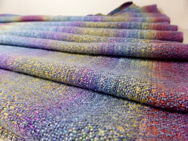 Rainbow End wrap, grey silk weft, crackle weave, across close-up